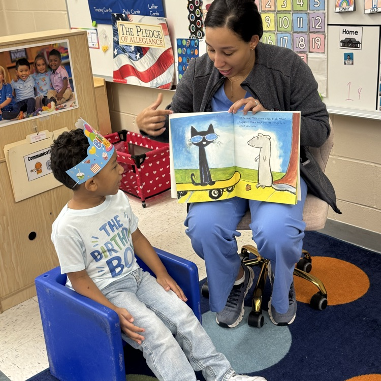 mystery reader in a classroom reading a book