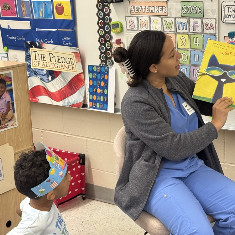 mystery reader in a classroom reading a book
