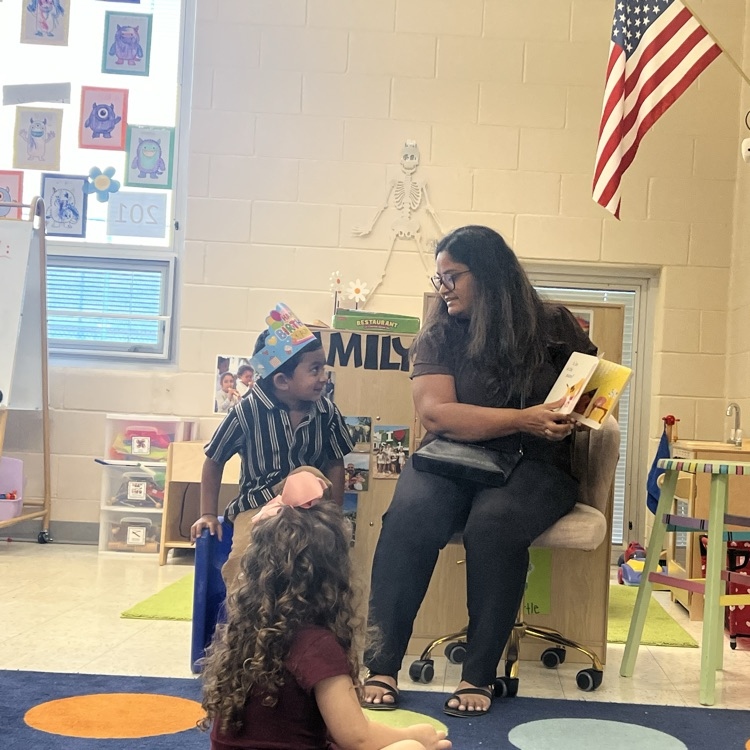 mystery reader in a classroom reading a book