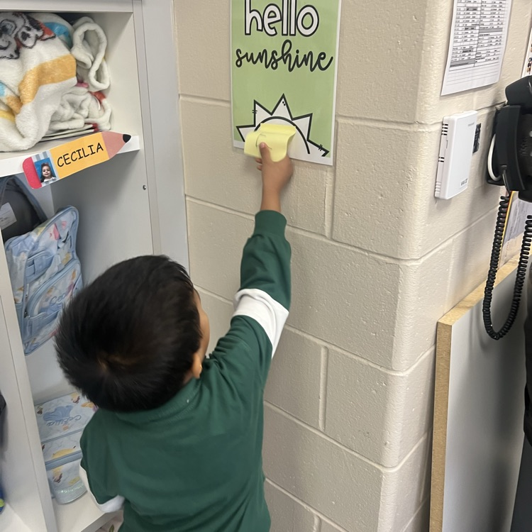 Students finding letters around the room