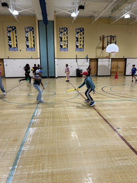 Kids playing ball in the gymnasium