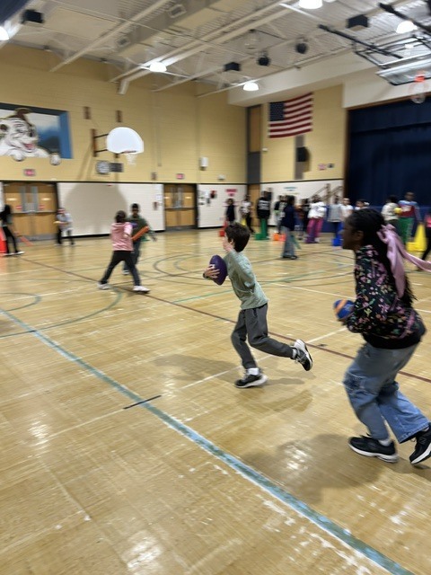 Kids playing ball in the gymnasium