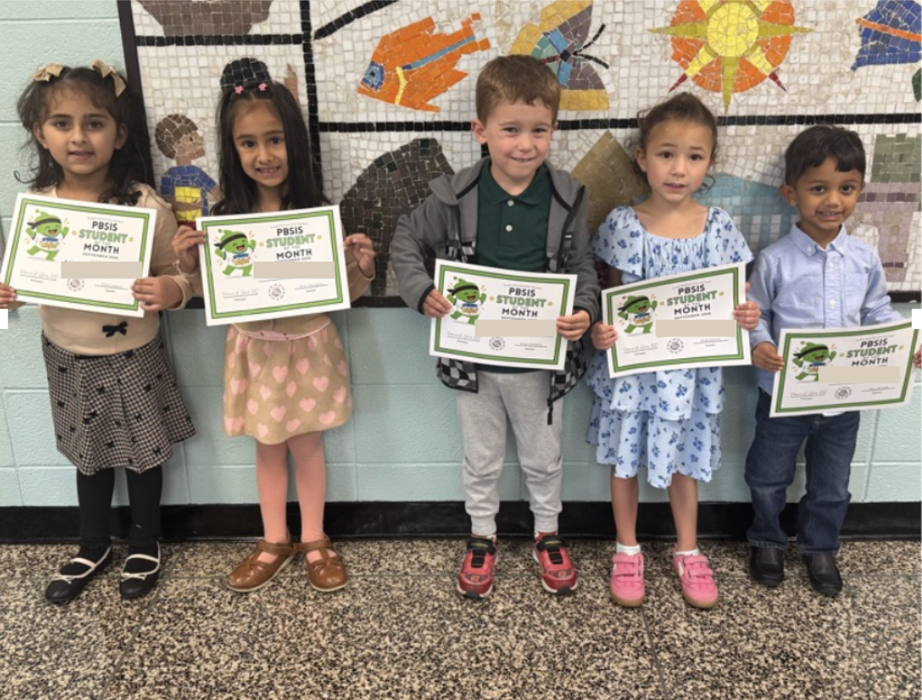 Students holding certificates