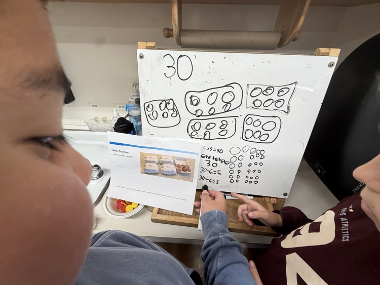 white board with math counters drawn on it