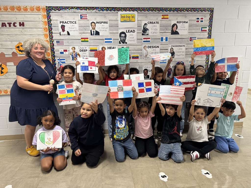 Students holding up flags in a hallway