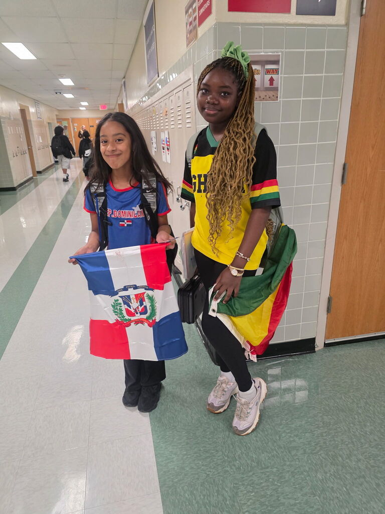 Students in hallway with flags