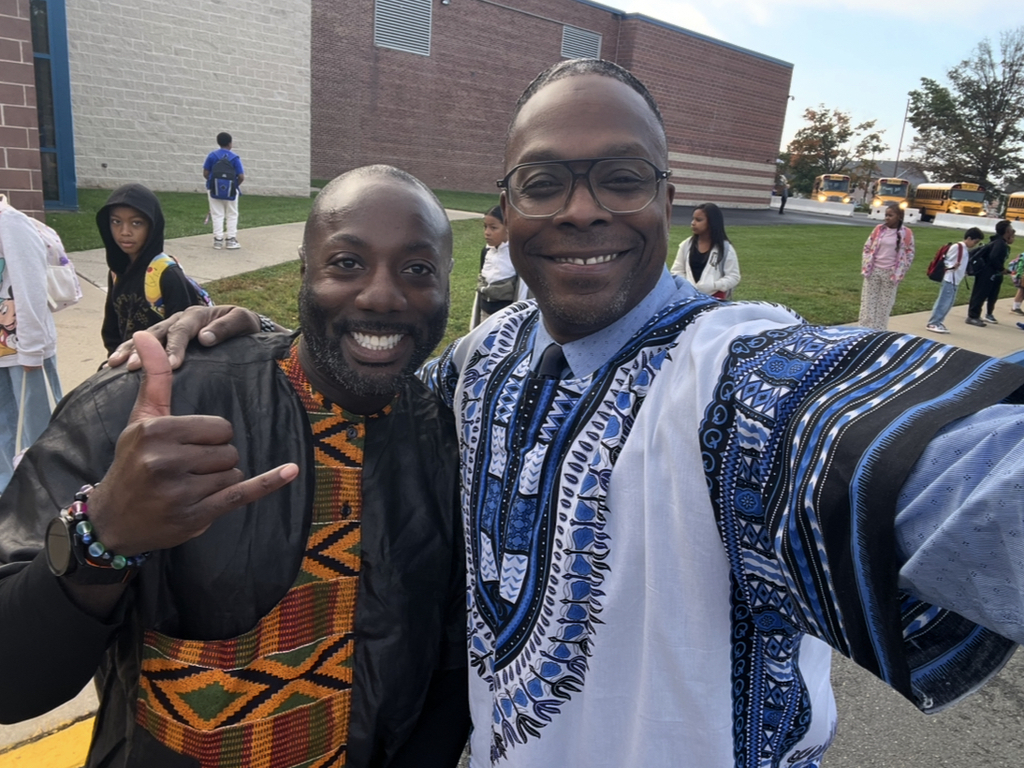 Two staff members posing together