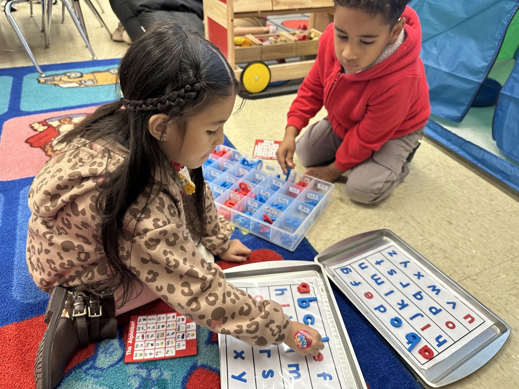 Students working in workstations.