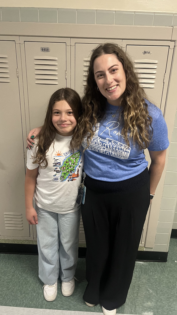 Student and teacher posing together