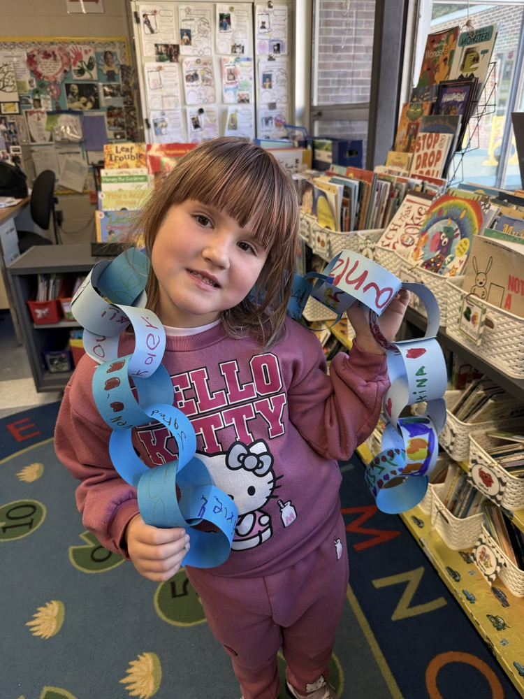 Student holding Respect Chain