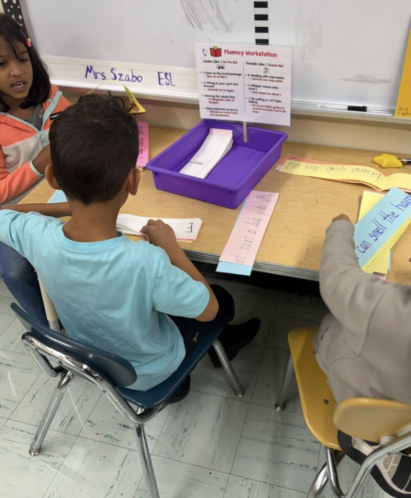 Students working in workstations.