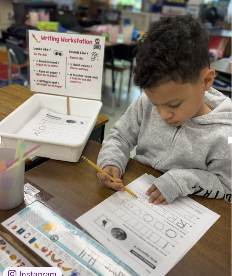 Students working in workstations.