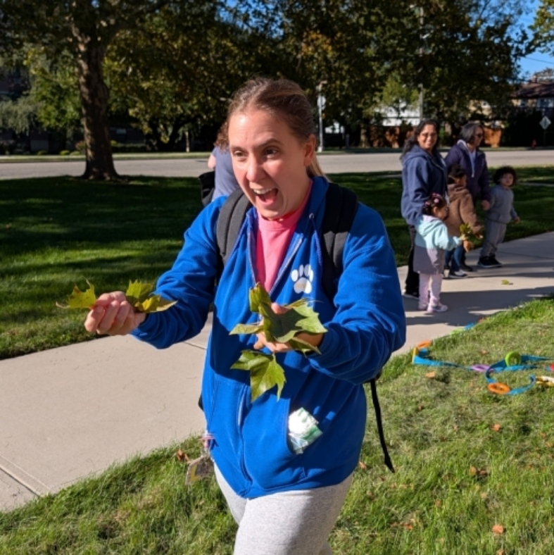 teacher holding leaves