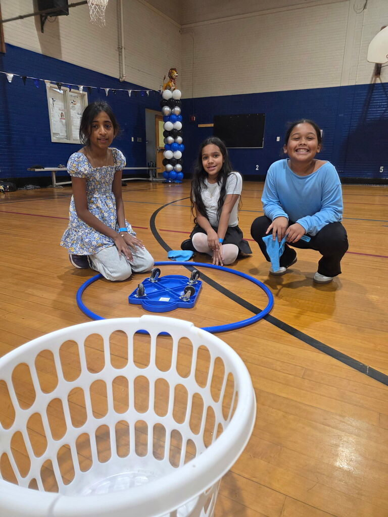 Students playing games in gym at a pep rally
