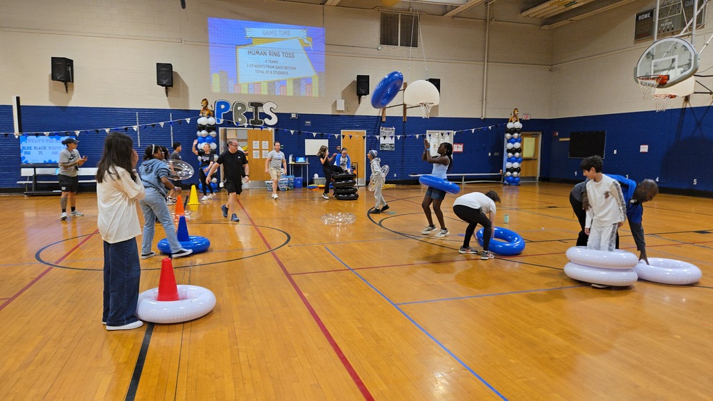 Students playing games in gym at a pep rally