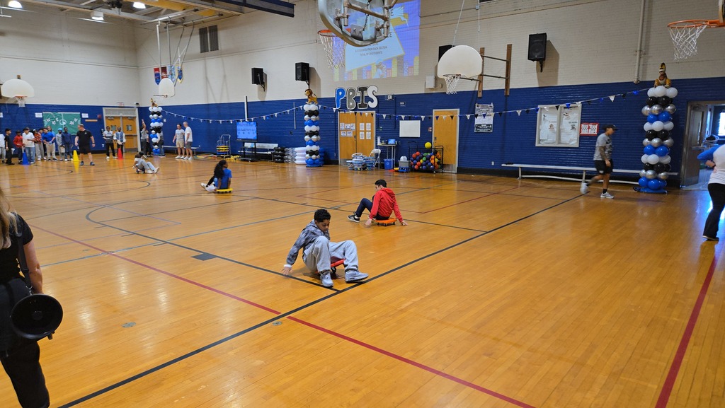 Students playing games in gym at a pep rally