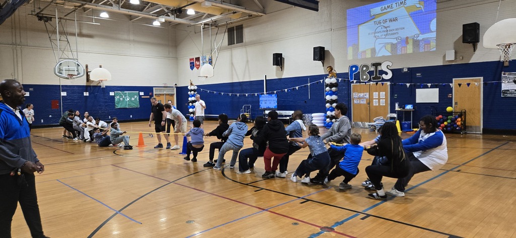 Students playing games in gym at a pep rally