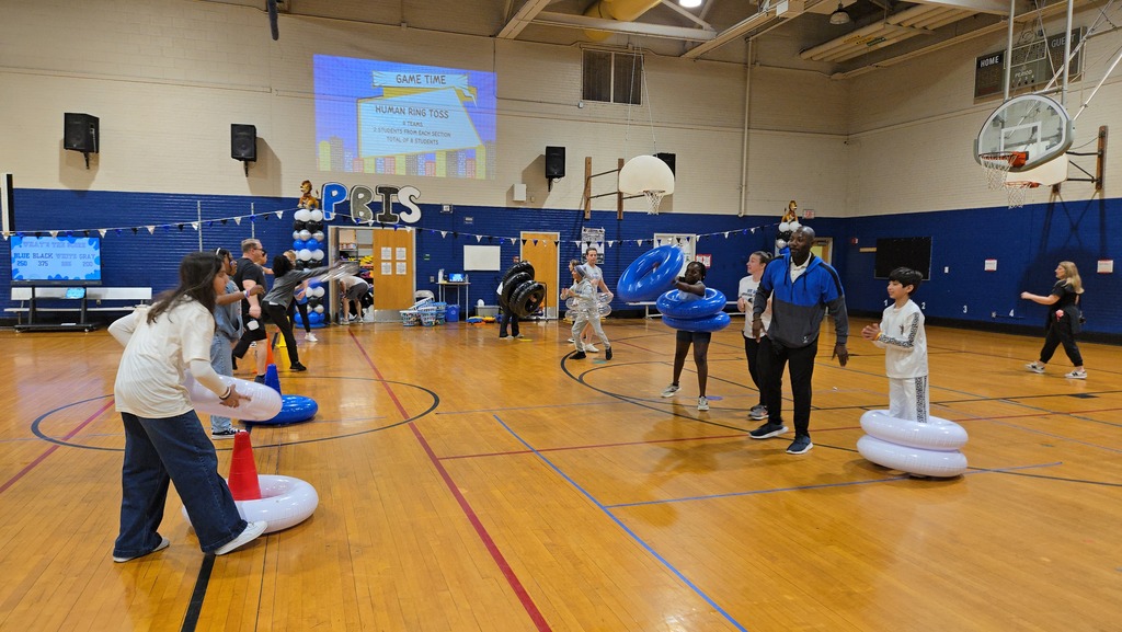 Students playing games in gym at a pep rally