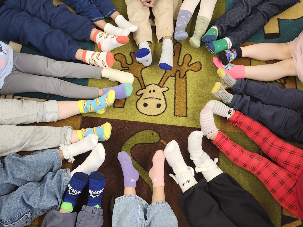 Students showing off socks for Sock Day at Judd! 