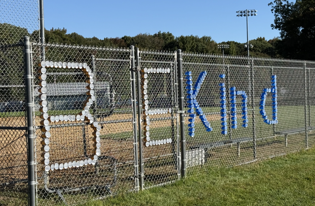 Be Kind spelled out in fence
