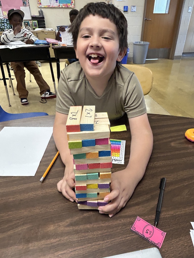 Student happily plays Jenga
