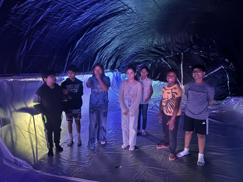 Students posed in front of Whale model