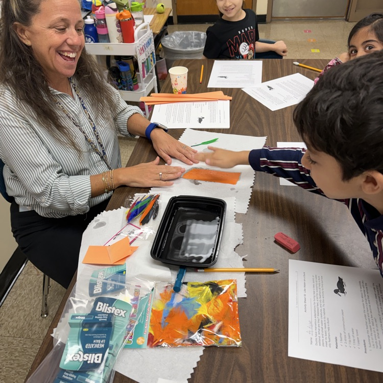 students working on a science experiment 