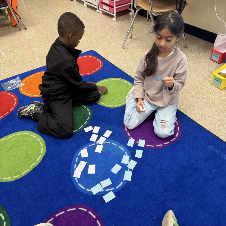 students playing an animal adaptation matching game  