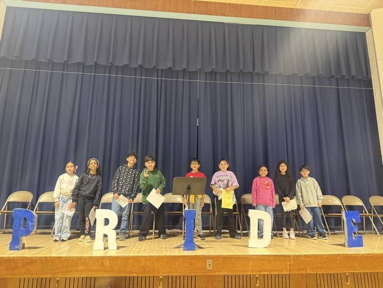 Students standing on stage 