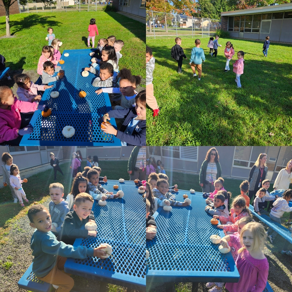 Students at outside table with their pumpkins