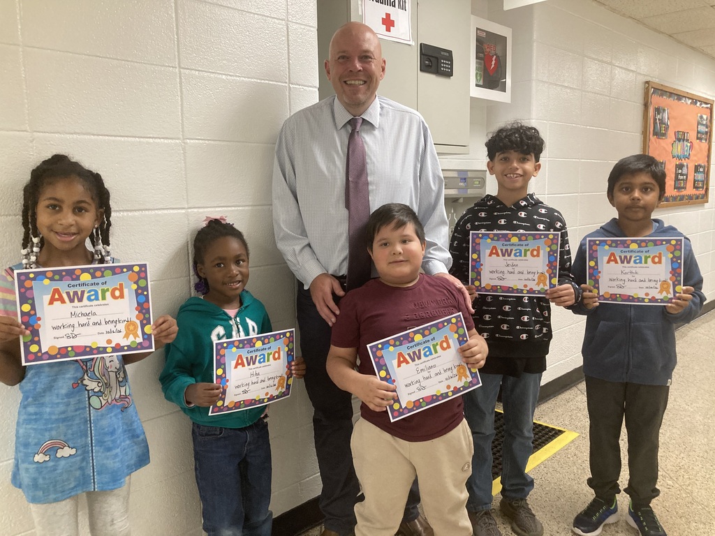 Students standing with Principal for Friday Five 10/16/26