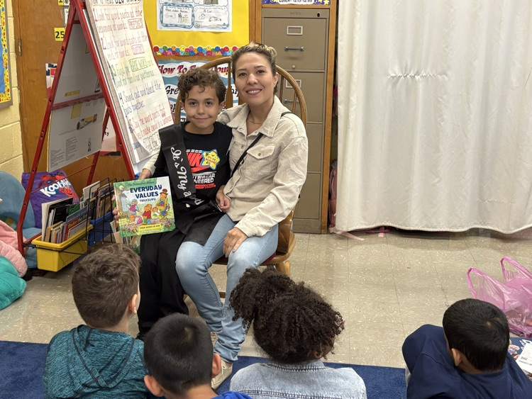 Student sitting with his mom