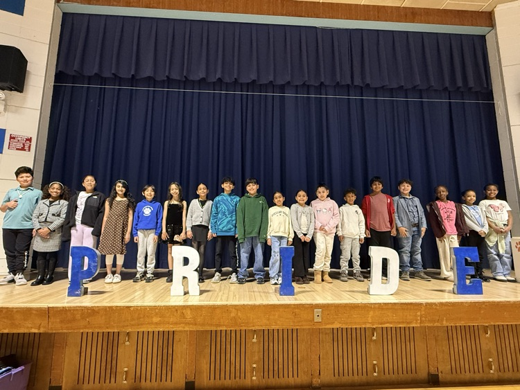 Large group of students standing on stage