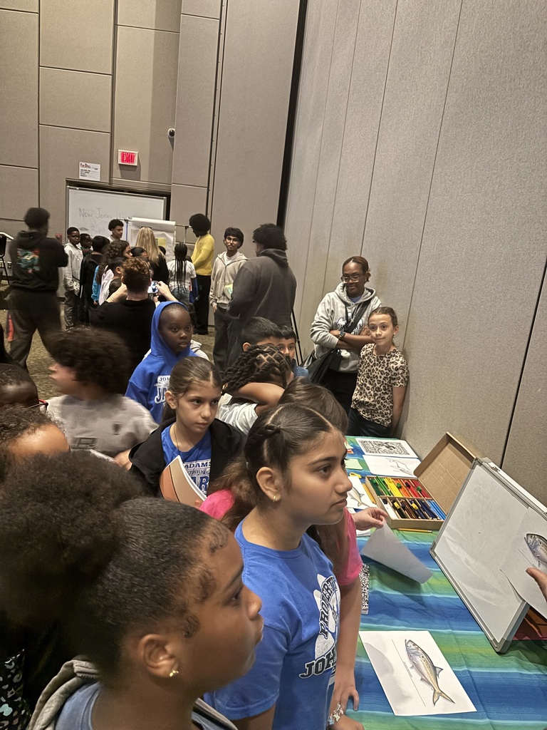 Students traveling to various table presentations