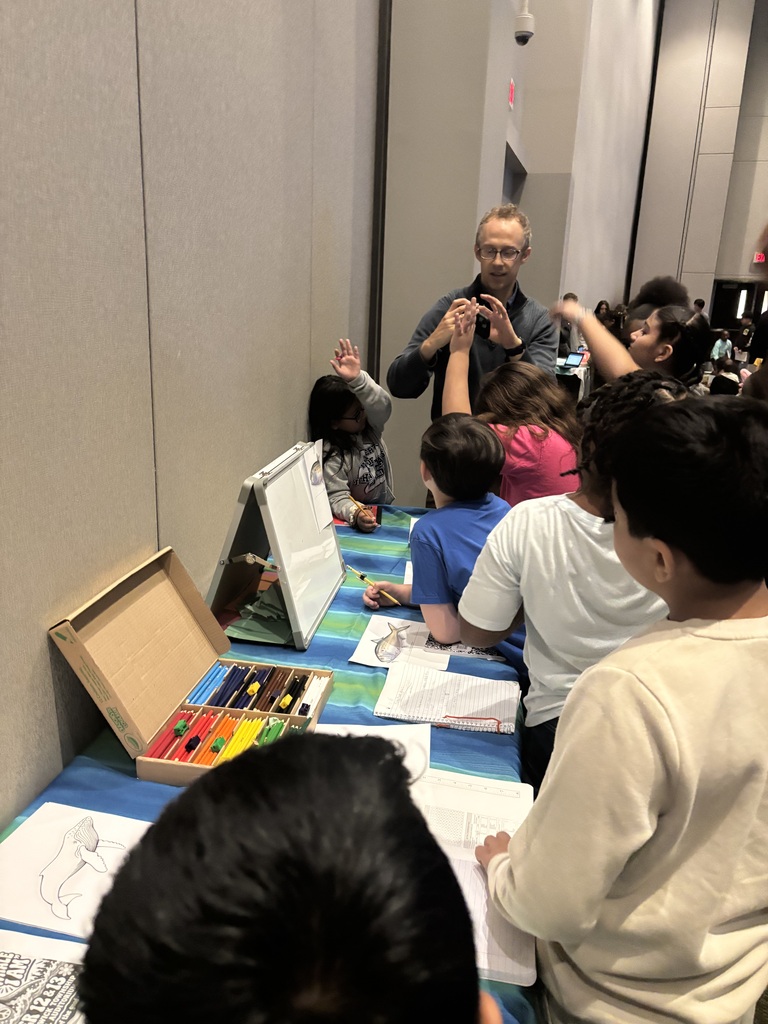 Students at a table presentation