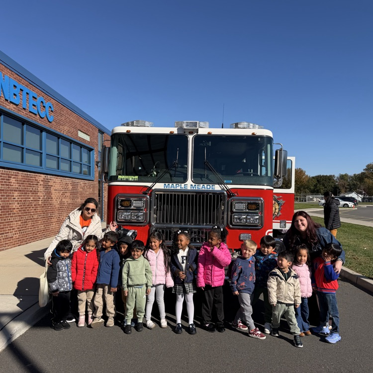 Students posed in front of fire truck