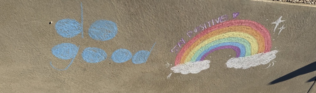 students making positive messages in chalk