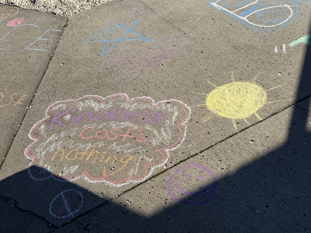 students making positive messages in chalk