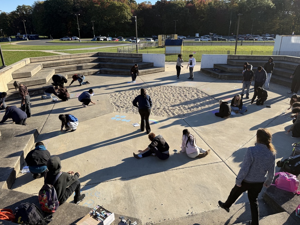 students making positive messages in chalk