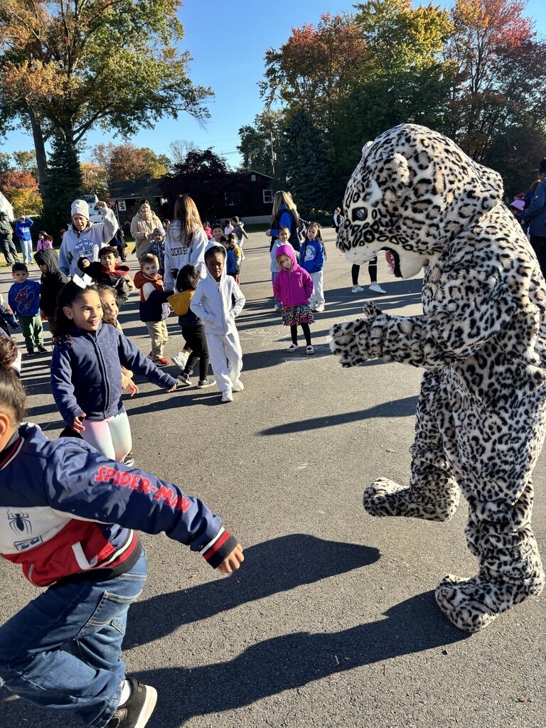 students laughing at the jaguar mascot