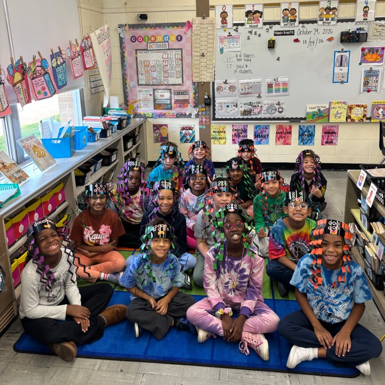 Class photo of students on the carpet