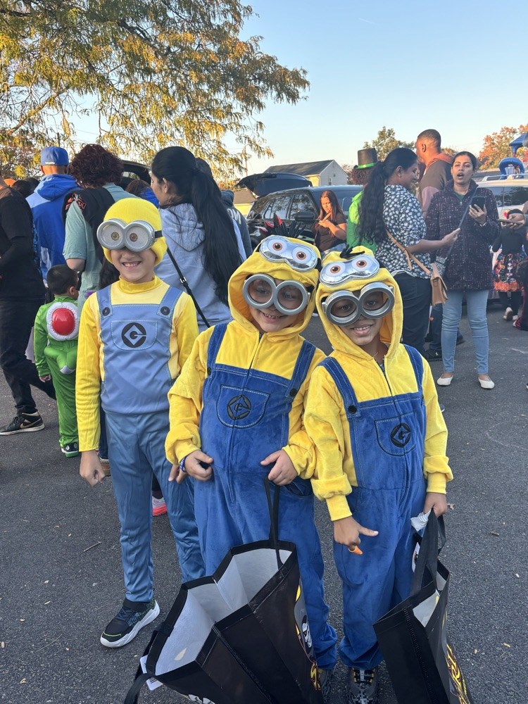 Kids in halloween costumes at school event outside