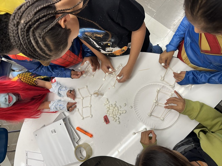 students working together to design a haunted house
