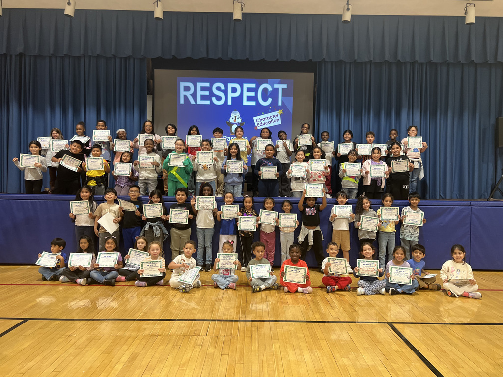 Large group of students posing with certificates