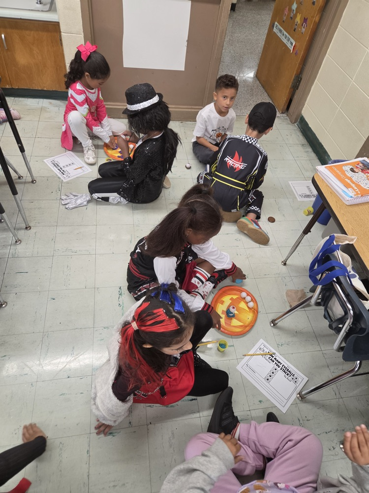 students working together on the floor