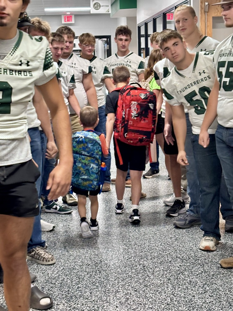 NC Football team greeting NCES students