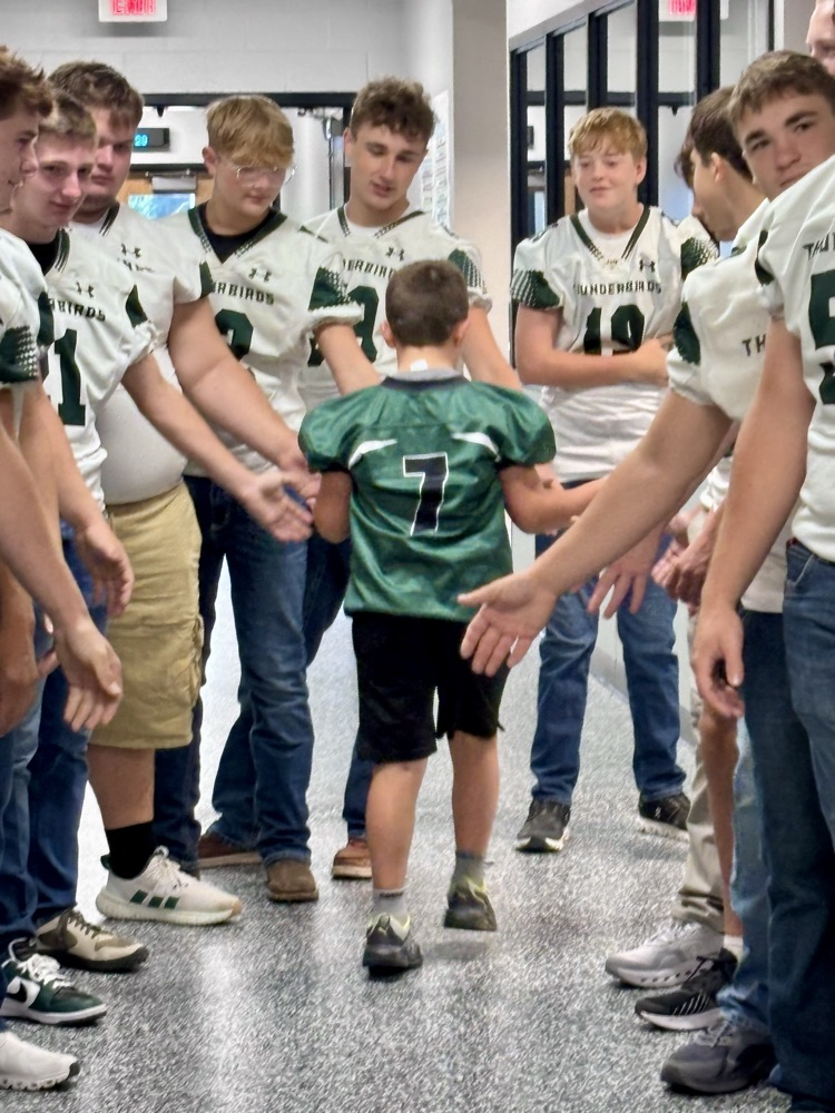 NC Football team greeting NCES students