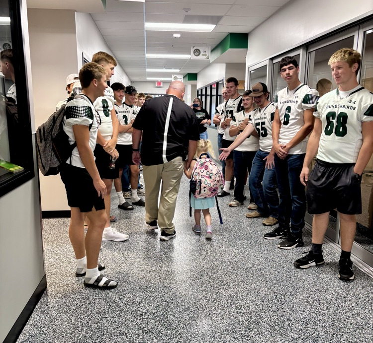 NC Football team greeting NCES students