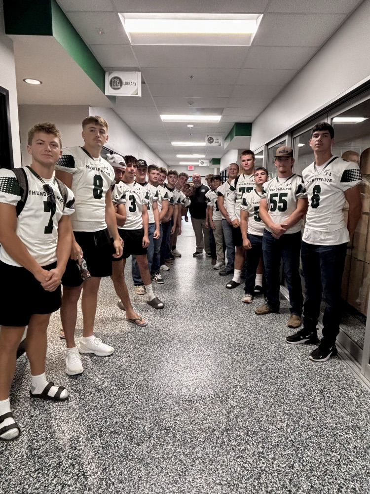 NC Football team greeting NCES students