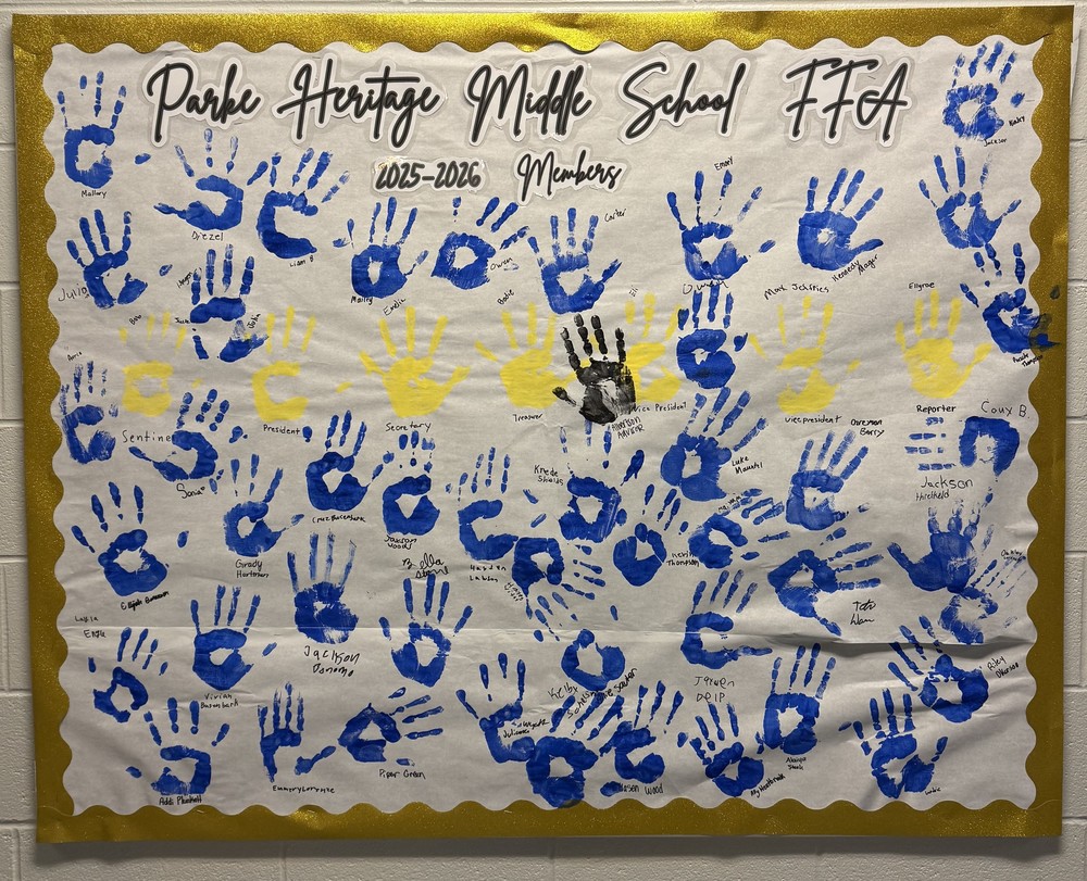 a bulletin board with handprints and names on it